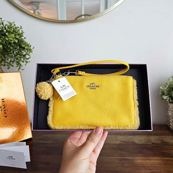 Vintage NWT Coach Shearling Small Wristlet in Banana Yellow With Pom Pom - Picture 2 of 16